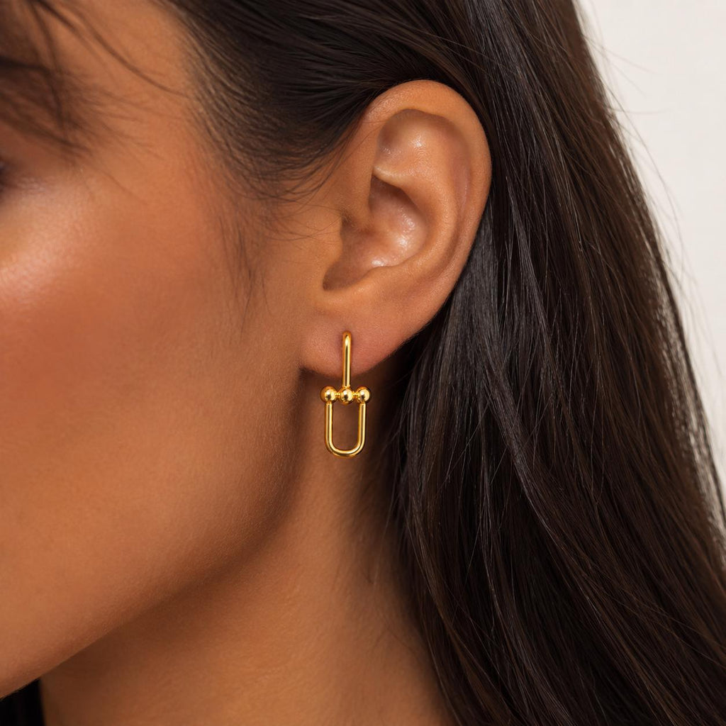 Aros Geométricos Dorados con Baño de Oro 18K.